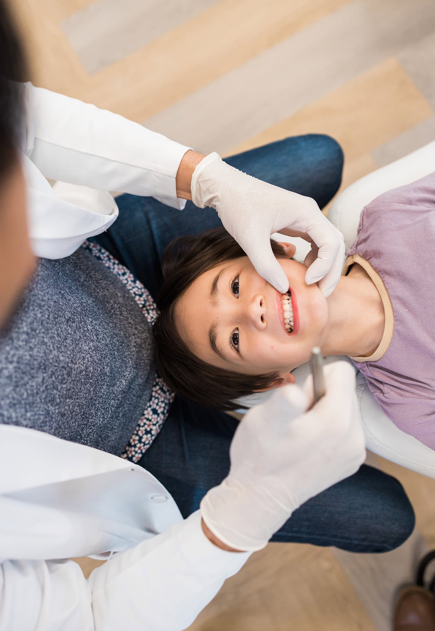 Child receiving gentle pediatric dental exam in Irvine, CA.